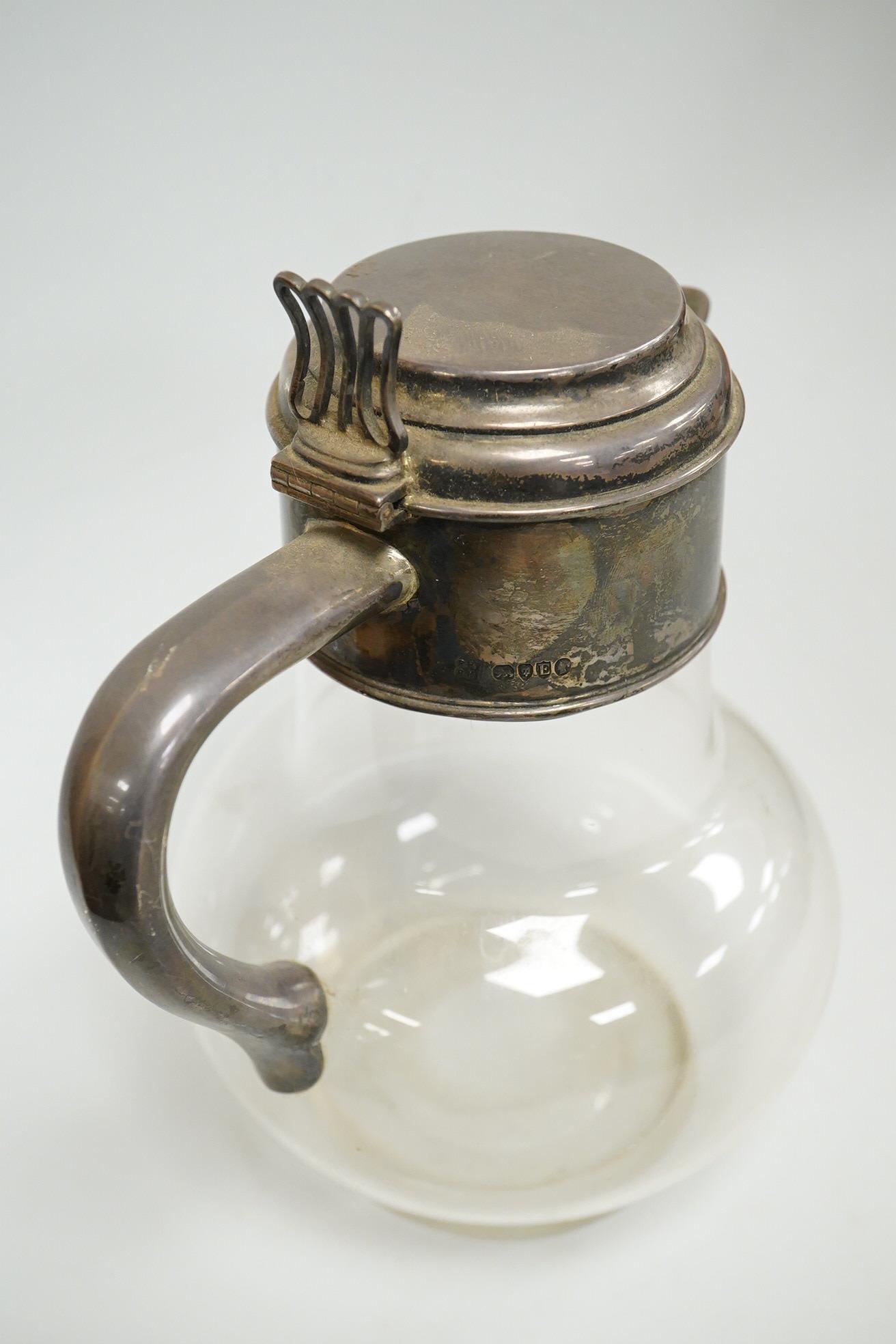 A late Victorian silver mounted plain glass bulbous claret jug, Richard Hodd & Son, London, 1880, height 19.7cm.